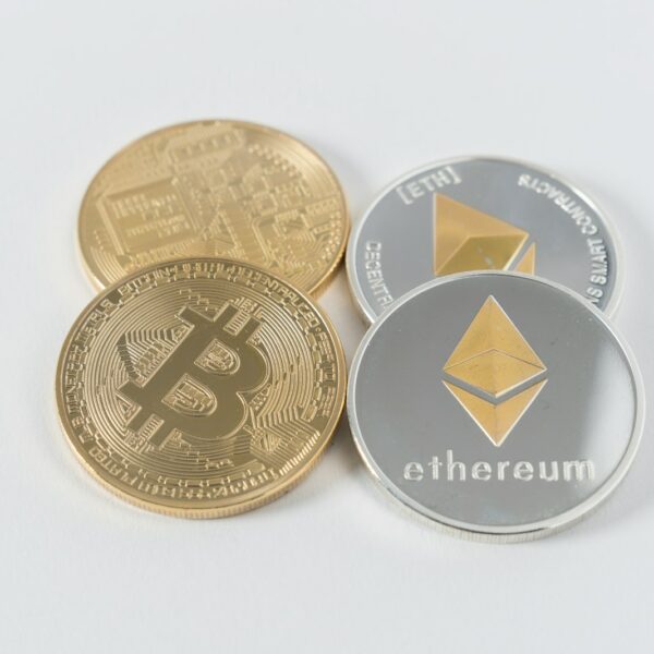 four round silver-colored and gold-colored Bitcoins